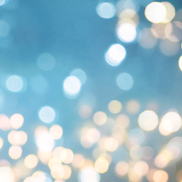 istock Christmas light background.  Holiday glowing backdrop. Defocused Background With Blinking Stars. Blurred Bokeh. 1013768734