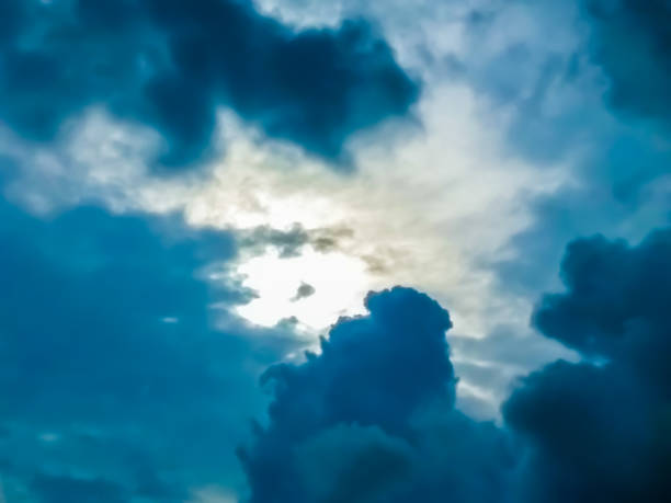 Deep Blue Clouds In The Sky Dramatic dark blue cloud formations in the sky stratosphere meteorology climate air stock pictures, royalty-free photos & images