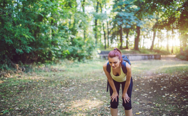 istock Woman resting after long walk through the forest. 1013779858