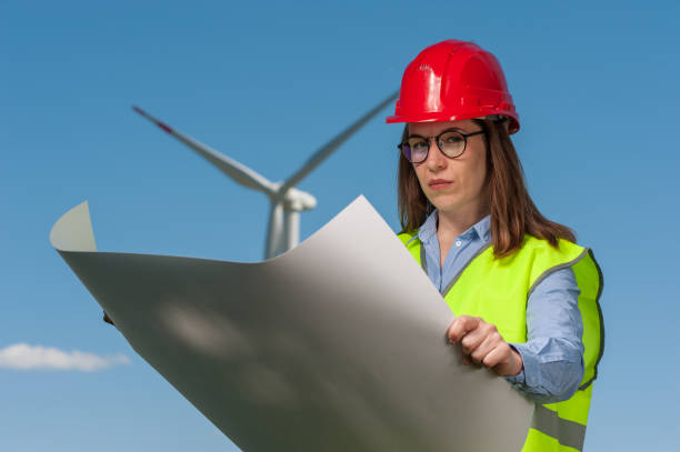 istock Concept of engineers and windmills 1013784484