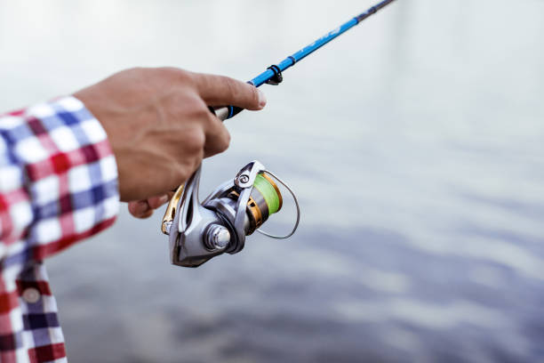 istock Fishing in the river at sunset. 1013792566