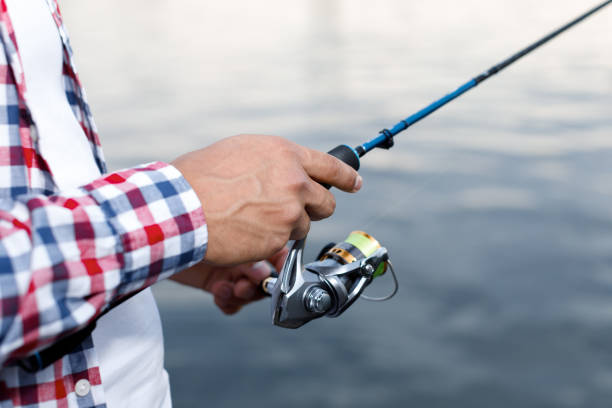 istock Fishing in the river at sunset. 1013792904