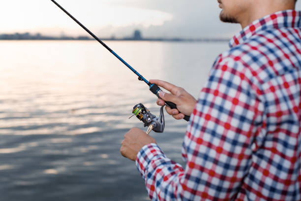istock Fishing in the river at sunset. 1013795718