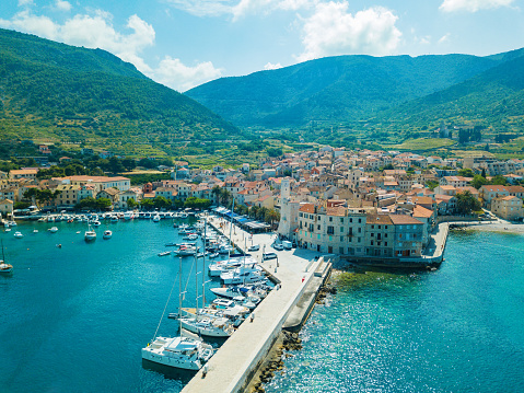 Komiža town on island Vis, Dalmatia, Croatia, where parts of Mamma Mia 2 movie were filmed. Photo made with drone DJI Mavic Pro from above.
