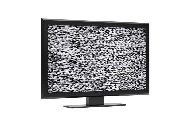 A television in a yellow room has been broken and melted after a fire in the now abandoned home.