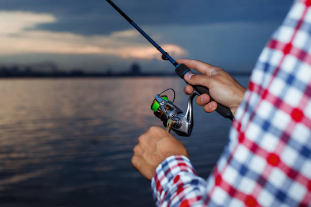 istock Fishing in the river at sunset. 1013803028