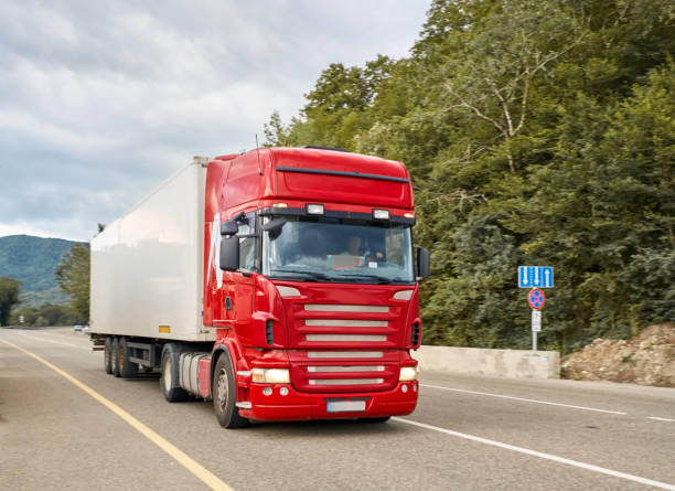 istock big truck driving on the highway 1013806006