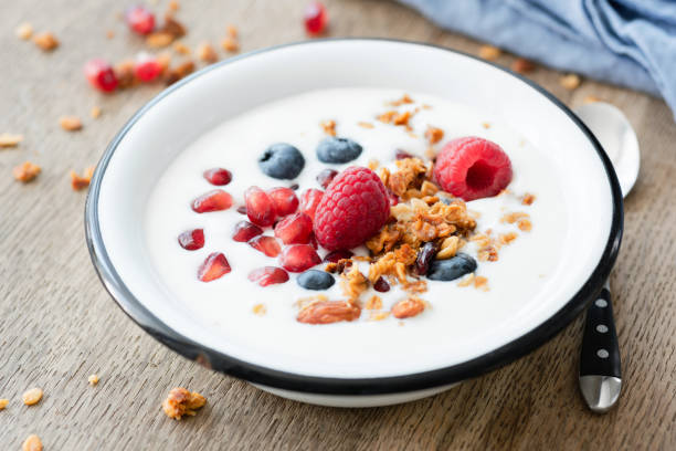 istock Yogurt with pomegranate, blueberry and granola in bowl 1013828728