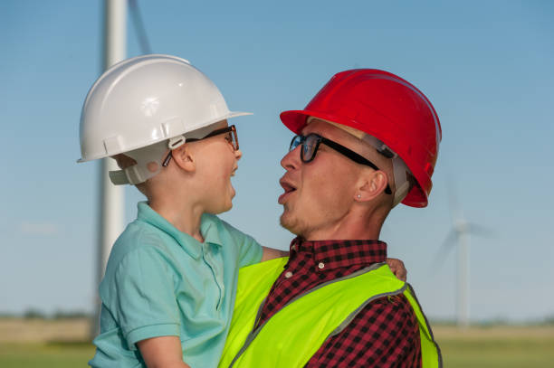 istock Concept of engineers and windmills 1013834824