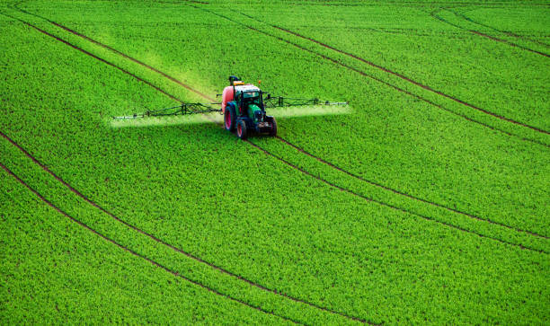 istock Farm machinery spraying insecticide 1013839400