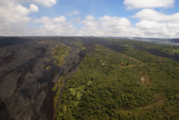 istock Lone House - Lava Covered Area 1013839476