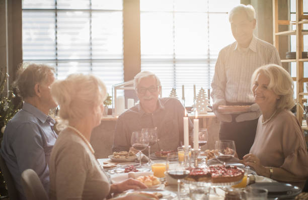 istock Seniors Christmas dinner party 1013839990