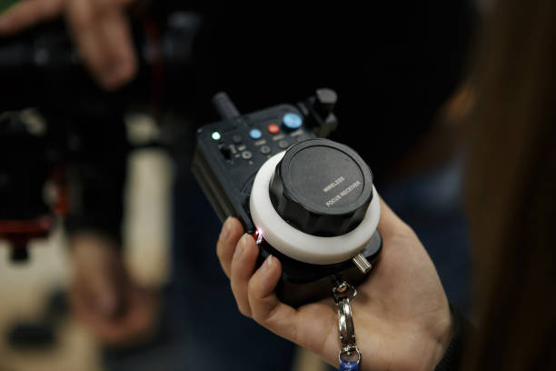 istock Male hands hold the wireless follow focus system during the filming process. 1013853634