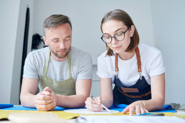 istock Team of clothiers at work 1013858132