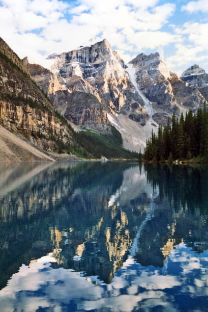 istock Moraine Lake in summer with reflecting mountain peaks 1013870018