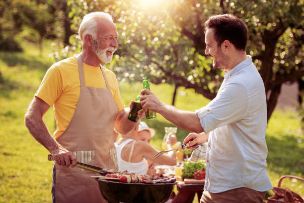 istock Family having a barbecue in a park 1013878474