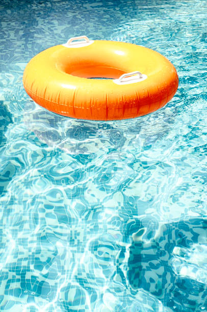 istock ring floating in a refreshing blue swimming pool 1013878484