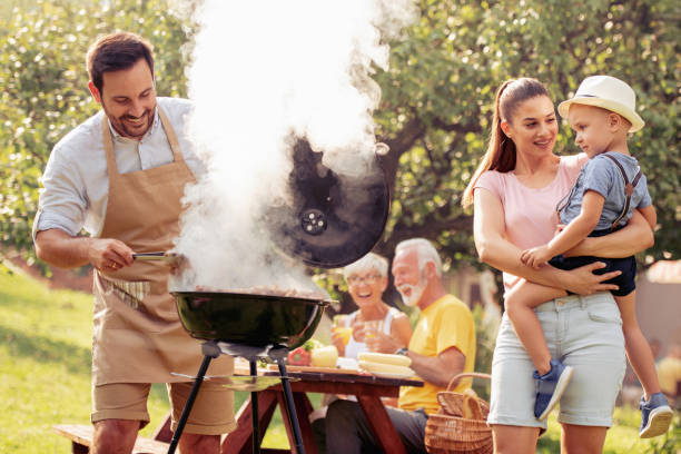 istock Family having a barbecue in a park 1013881370