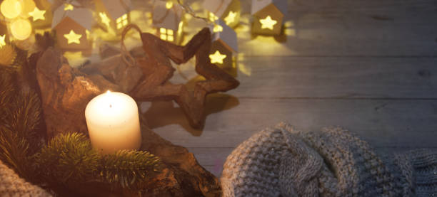 istock Cosy and soft winter background, knitted sweater and lights 1013883996