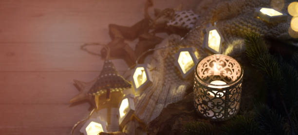 istock Cosy and soft winter background, knitted sweater and lights 1013884240