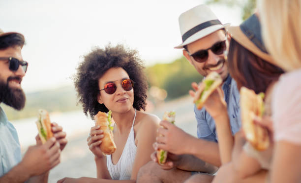 istock Group of friends having fun on the beach 1013886560