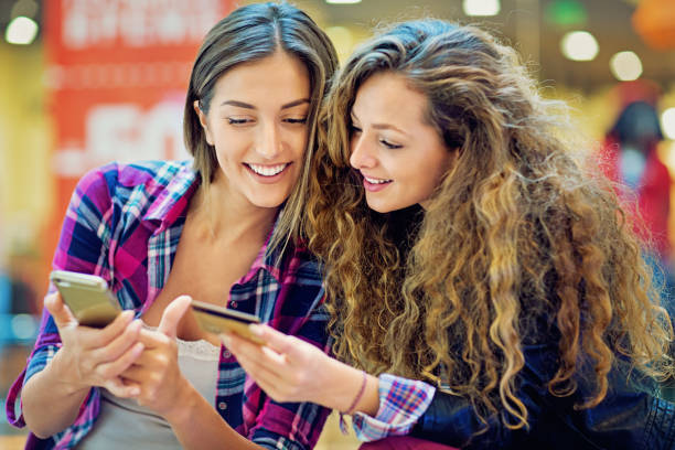 istock Girlfriends are shopping online in the Mall 1013891380