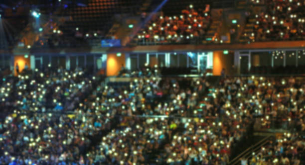 istock Blurred background of people and light in conference hall. 1013896234