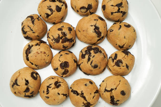 istock Cookies and sweet biscuits on white plate 1013896658