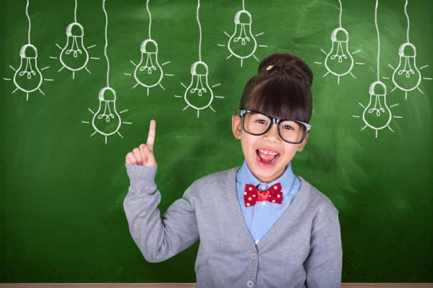 istock Little Asian teacher showing school education concept 1013901318