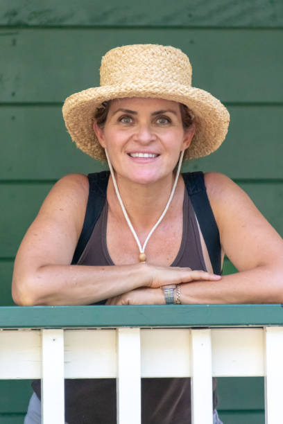 istock mature woman wearing a hat 1013904000