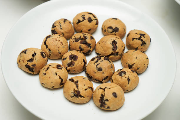 istock Cookies and sweet biscuits on white plate 1013904416