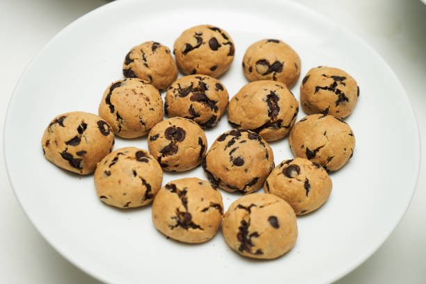 istock Cookies and sweet biscuits on white plate 1013904470