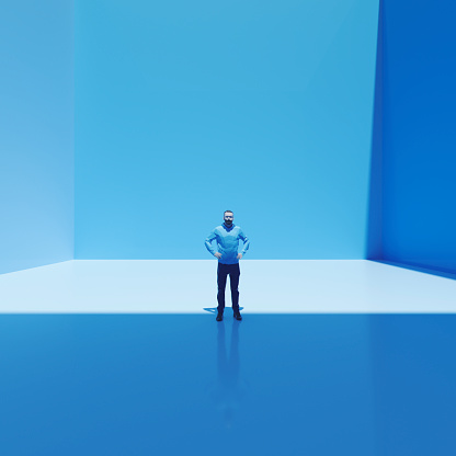 Surreal man standing in cubic room.