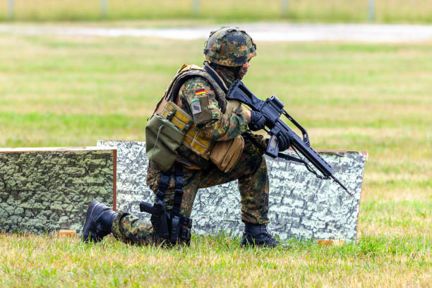 German soldier on an exercise at open day on day of the Bundeswehr Feldkirchen / Germany- June 9, 2018: German soldier on an exercise at open day on day of the Bundeswehr in Feldkirchen german armed forces stock pictures, royalty-free photos & images