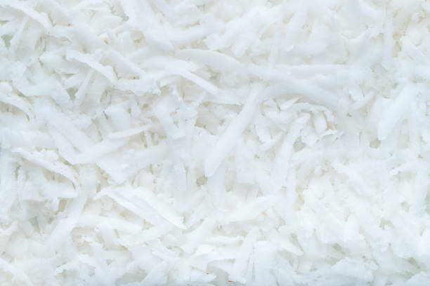 istock Fresh coconut flakes background. Top view. closeup. 1013923974