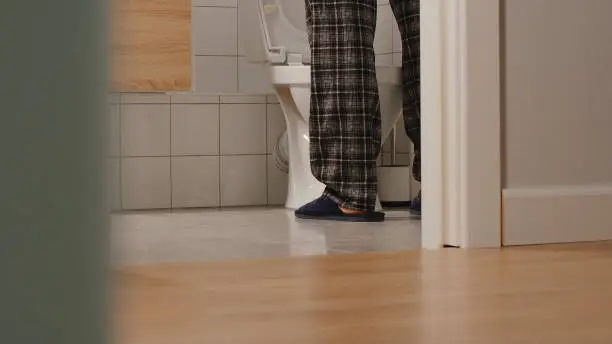 Photo of Adult man in a toilet at home