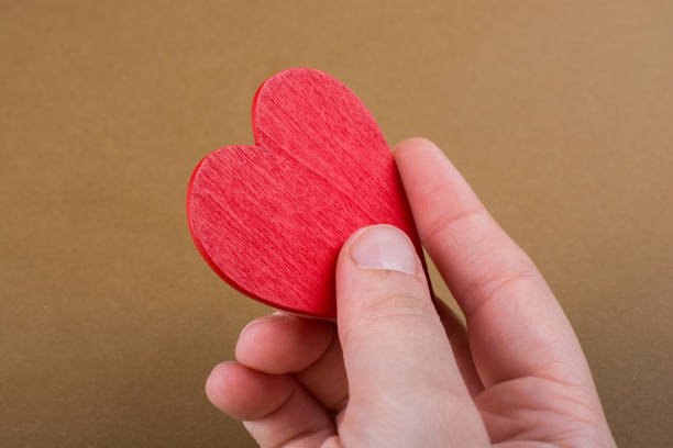 istock Red color heart shaped object in hand 1013940110