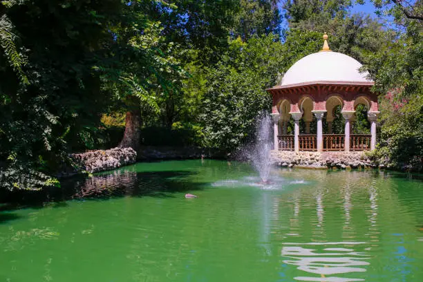Photo of Romantic Maria Luisa Park pond, Seville, Spain