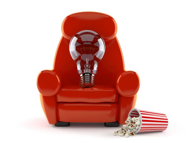 istock Light bulb with theater armchair and popcorn 1013960730