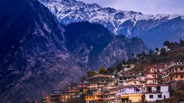 A holy, quiet and calm town in the laps of mountain ranges covered by snow in winter