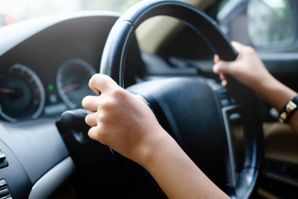 istock Female driving car. Vintage filter 1013964020