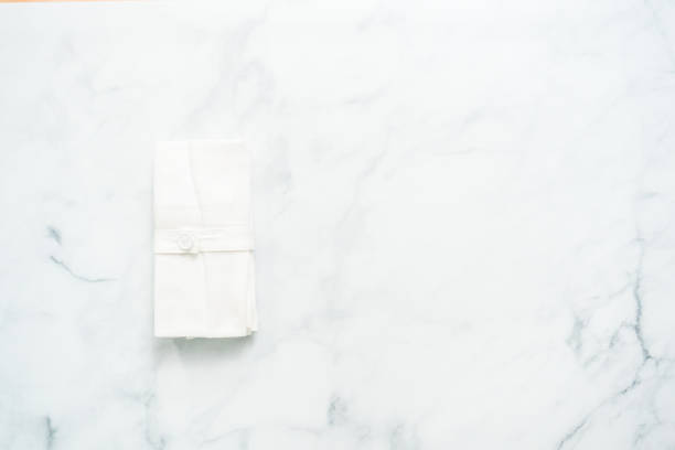 istock Stack of new linen dinner napkin on the kitchen counter. 1013977150