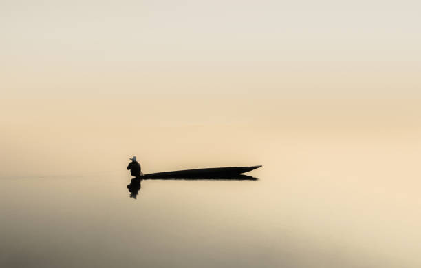 istock fishing boat in lake 1013989230
