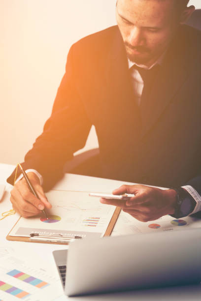 istock businessman working with smartphone in modern office 1013999518