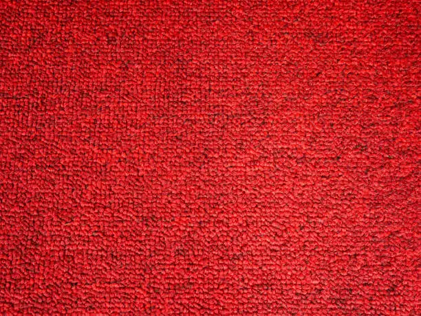 Photo of Elegance red color carpet texture background