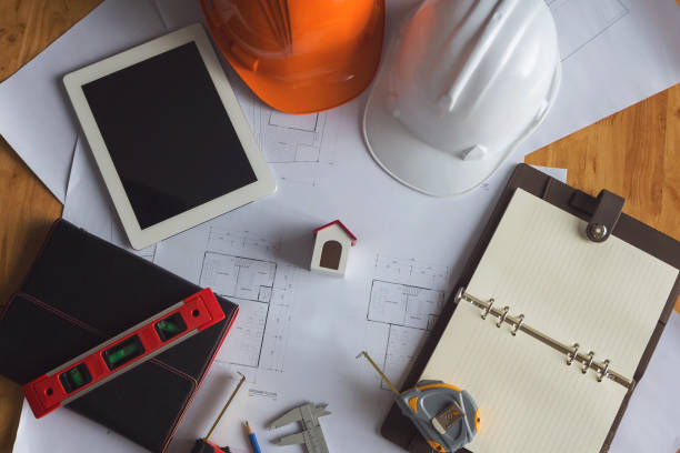 istock Engineer and Architect concept, Engineer Architects and real estate agent office desk. 1014022608