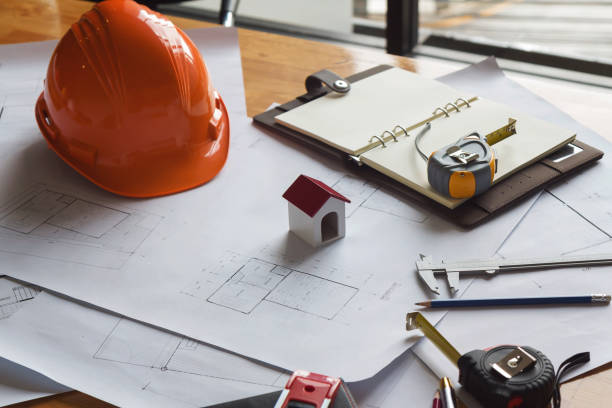 istock Engineer and Architect concept, Engineer Architects and real estate agent office desk. 1014022646
