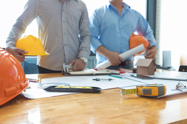 istock Engineer and Architect concept, Engineer Architects and real estate agent office team working with blueprints 1014022848