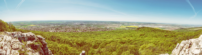 Panoramic view of the Nitra city from Zobor hill, Slovak republic. Spring time scene. Tourism theme. Yellow photo filter.