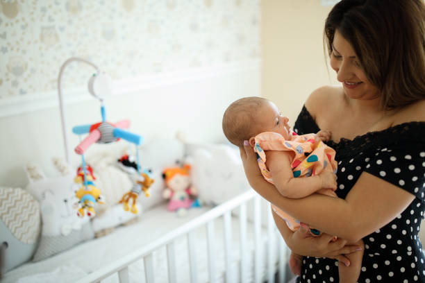 istock Safe and happy in  mother's arms 1014028042